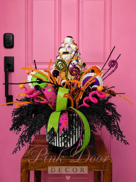Neon eyeball Halloween centerpiece in a striped box