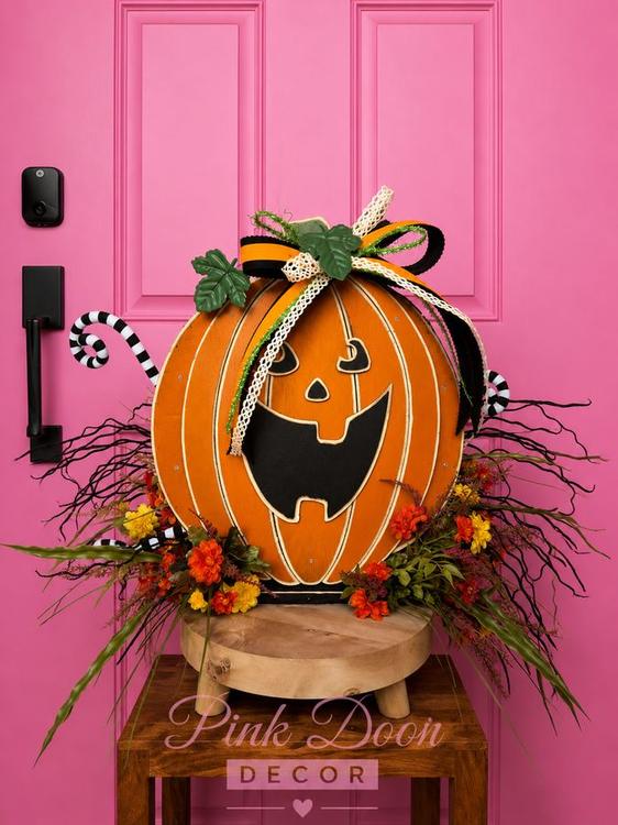 Vintage wooden jack-o-lantern centerpiece with fall florals